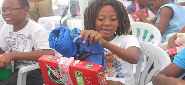 Samaritans Purse Operation Christmas Child shoebox gift distribution at the Mount Zion's Missions Inc Barbados Foursquare Church Impact Community Outreach Children's fun Outreach in Barbados